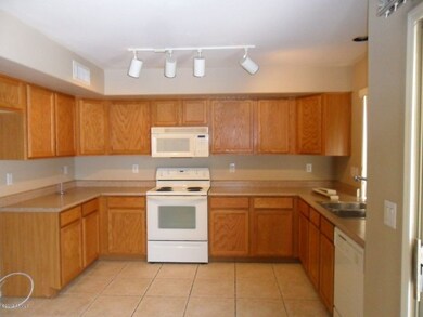 VIEW OF KITCHEN FROM FAMILY ROOM