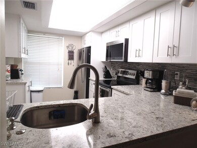 Kitchen featuring stainless steel appliances, a si