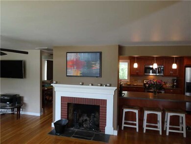 Exterior Front. Living room, fireplace and kitchen