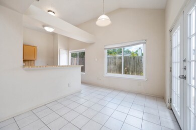 Make memories gathered around the table with your family and friends! This dining room features high ceilings, large windows, tile floors, and access to the backyard!
