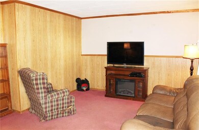 Plush wall-to-wall carpeting gives this room a war