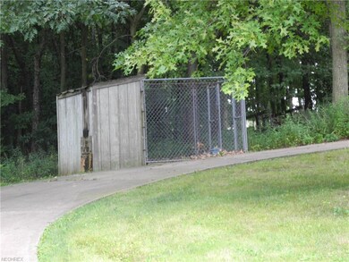 A large fenced animal cage.