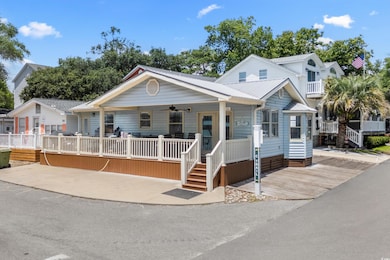 View of front facade featuring covered porch and a ceiling fan