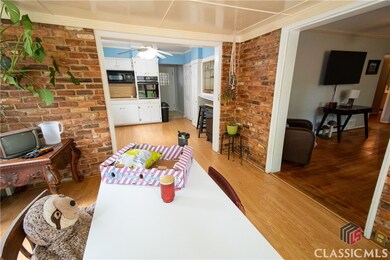 Dining Room with Sunroom/Greenhouse/Catio to the l