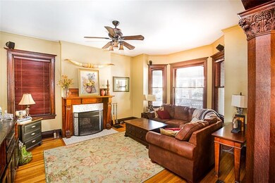 Spacious living room with wood-burning fireplace, 