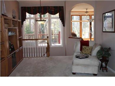 Formal living area with open stairway and great wi