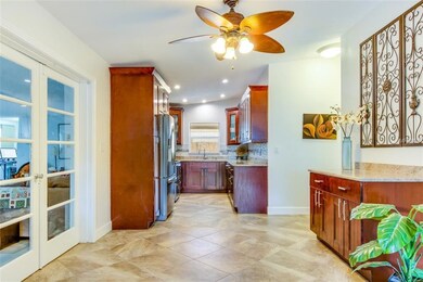 Kitchen area and entrance to the family/living room via French Doors