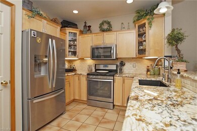 Custom maple cabinets with under mount lighting.