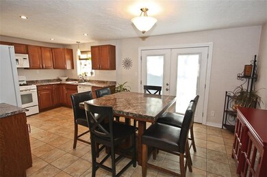 The dining room is open to the kitchen. Newer door
