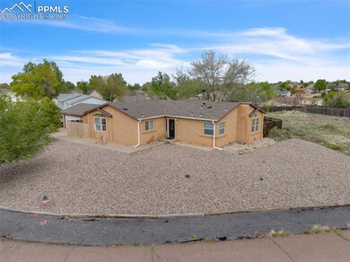 View of front of property with fence and stucco si