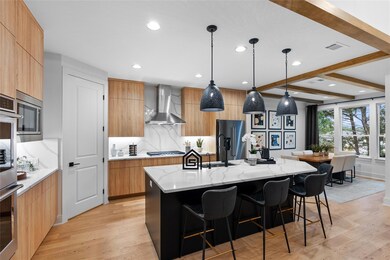Kitchen with light wood finished floors, modern c
