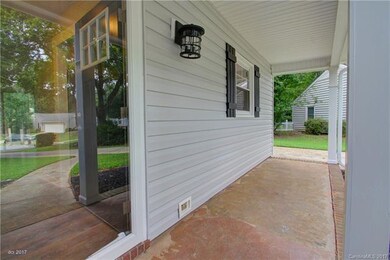 COVERED PORCH: This home features great curb appea