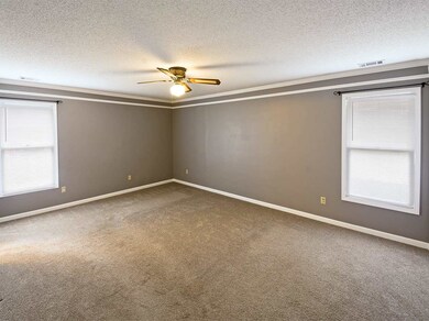 Extra large master bedroom featuring new carpet, c