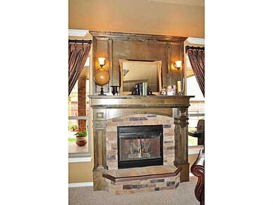 Living Room. Elaborate fireplace makes this living