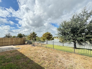 NEW left-side fence in backyard with concrete patio