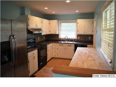 White cabinets with lots of countertop space, glas
