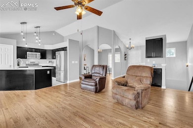 Living area featuring light wood-type flooring, ar