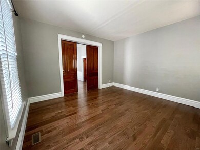 Unit 1 boasts wood pocket doors to close off rooms