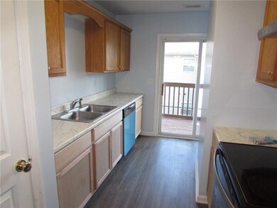Kitchen featuring dark wood-type flooring, visible
