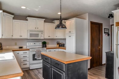The kitchen has a pantry and center island.