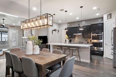 Dining area featuring ceiling fan, wood finished 