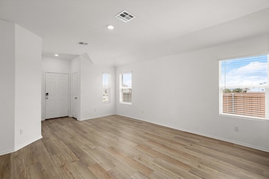 Empty room featuring light wood-style floors, bas