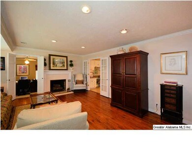 Living room is anchored by fireplace.