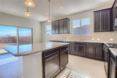 Kitchen with black range with gas cooktop, tastef