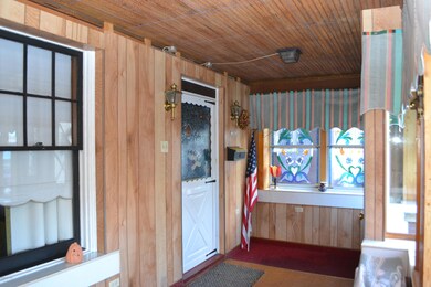 Front door on enclosed porch