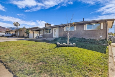 Ranch-style home featuring brick siding, a chimney, and a porch