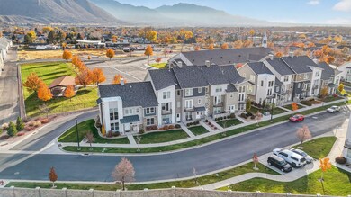 Aerial perspective of suburban area with a mountain backdrop