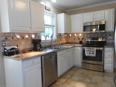 Enjoy views of the back yard from the updated kitchen.