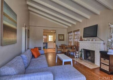 Cottage great room from the front door. High beam 