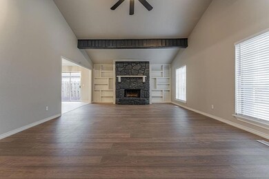 Unfurnished living room featuring built in feature