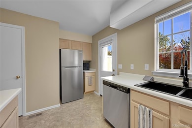 Kitchen overlooks the new deck and green space area