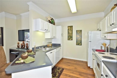 Kitchen featuring sink, hardwood / wood-style floo
