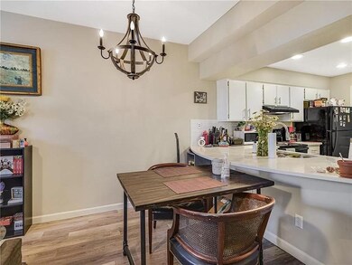 Dining area featuring light wood-style floors, a 