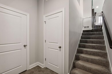Entry way with storage closet and garage access