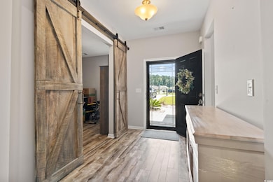 Entryway with light hardwood / wood-style floors a