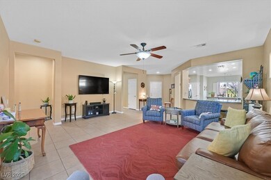 Living area with light tile patterned floors, rece