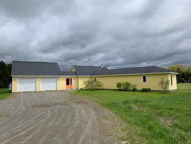 Front view of garage and master bedroo