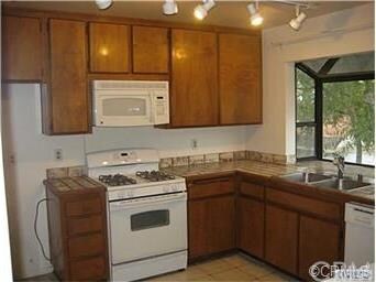 Light and bright kitchen with gas range and lots o