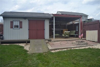Shed with electrical service and covered lounge ar