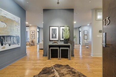 Hallway featuring light hardwood / wood-style floo