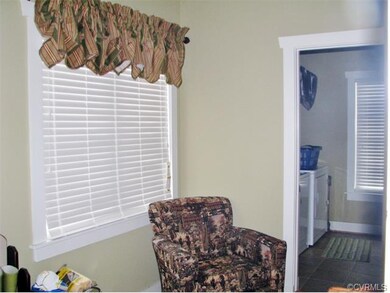 Large mud room and laundry room with access to rear yard.