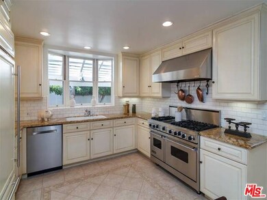 Kitchen with large mud room next to it