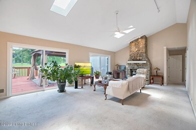 Spacious gr rm, dramatic stone hearth