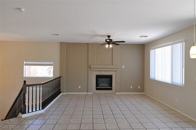 Large upstairs living area with fireplace, ceiling