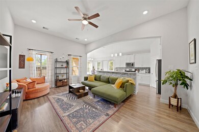 Great view of the open layout, showing the large living space flowing directly into the kitchen and dining area, perfect for entertaining.
