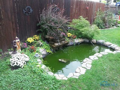 Exterior Back. Koi Pond